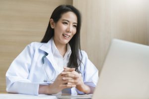 female virtually interviewing for a physician job