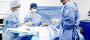International Medical Graduate surgeons preforming surgery on a patient